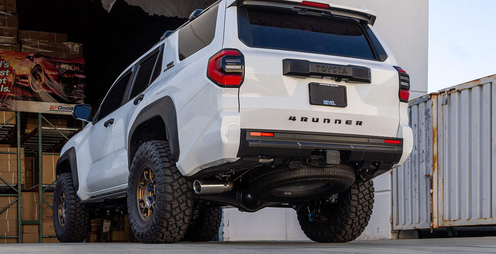 Toyota 4Runner SUV parked indoors highlighting off-road tires and modifications.